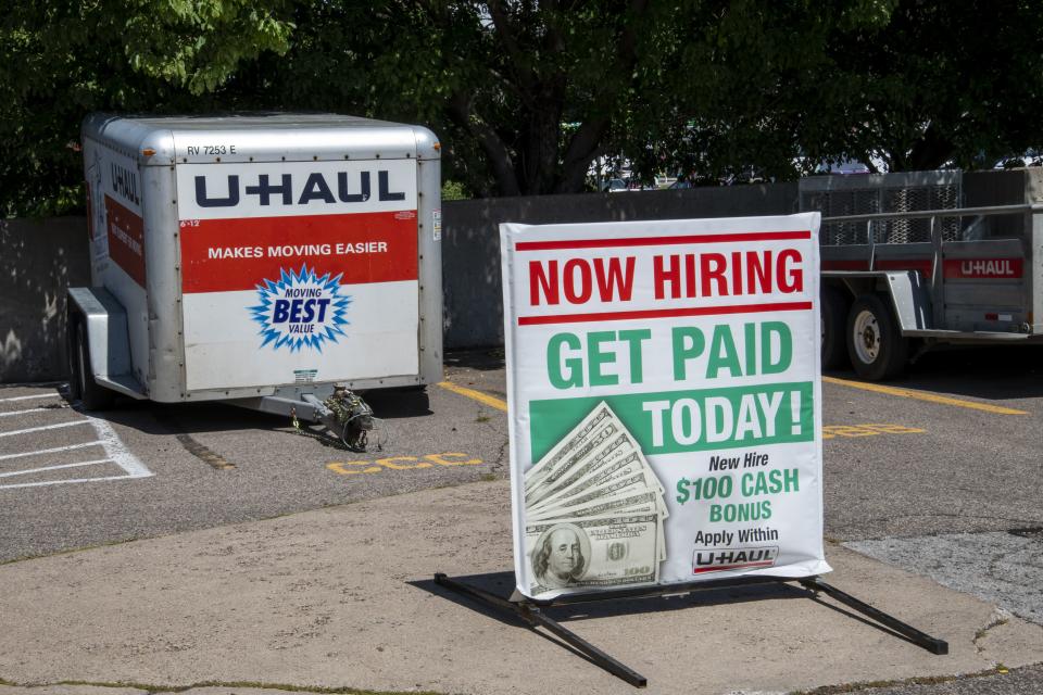 New Brighton, Minnesota.  Sign of employment at U-Haul offering to be paid today and a bonus.  (Photo by: Michael Siluk/UCG/Universal Images Group via Getty Images)